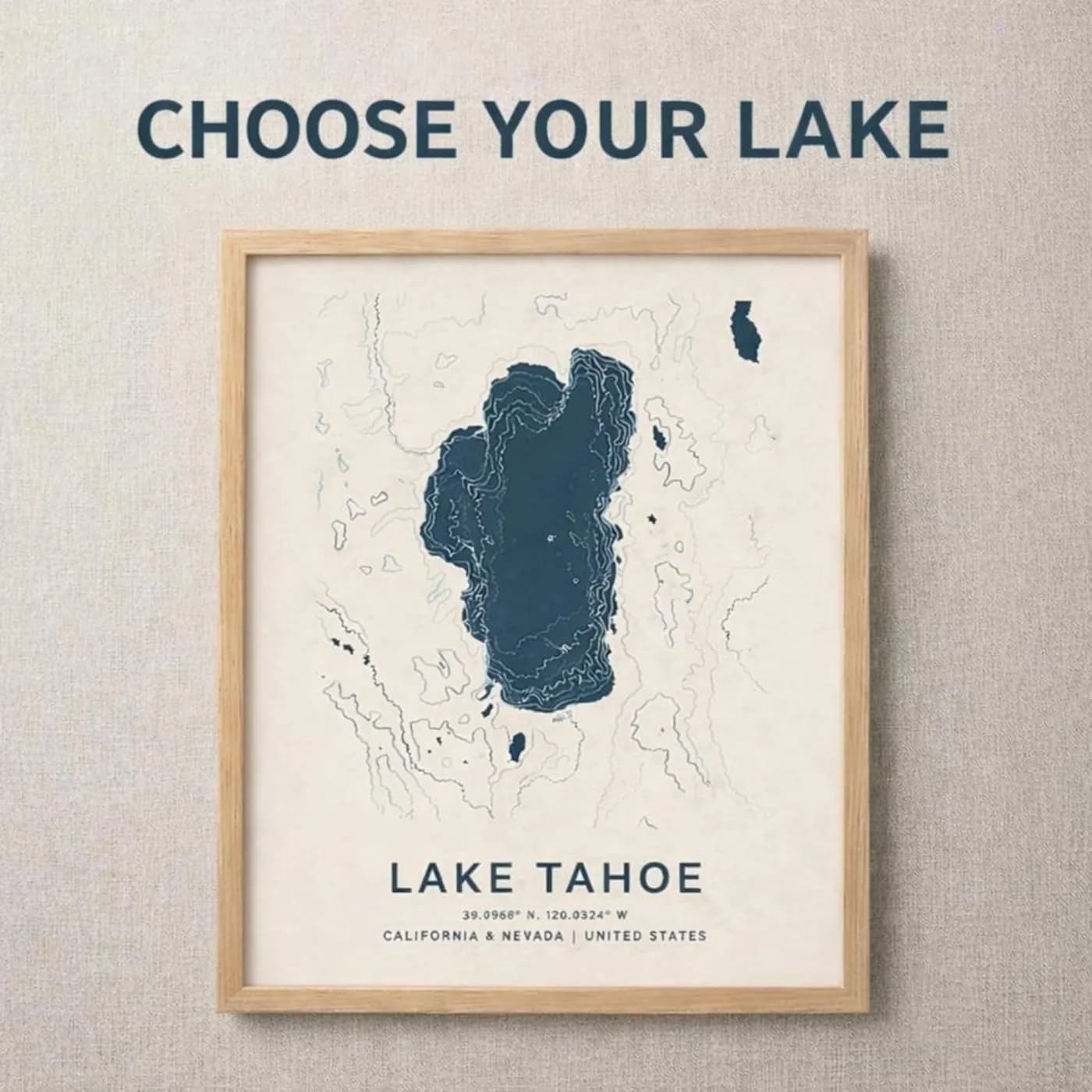 Framed oak Lake Tahoe map poster on a linen wall under a Choose your lake heading, navy lake on cream