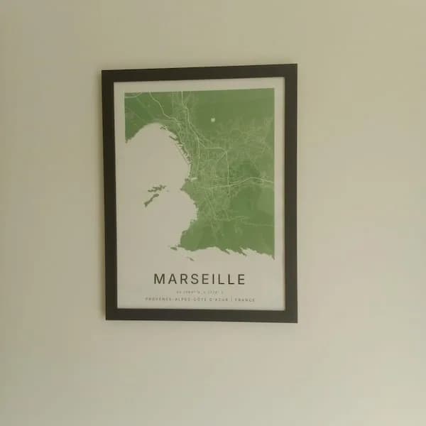Framed Marseille city map poster in green hung on a wall